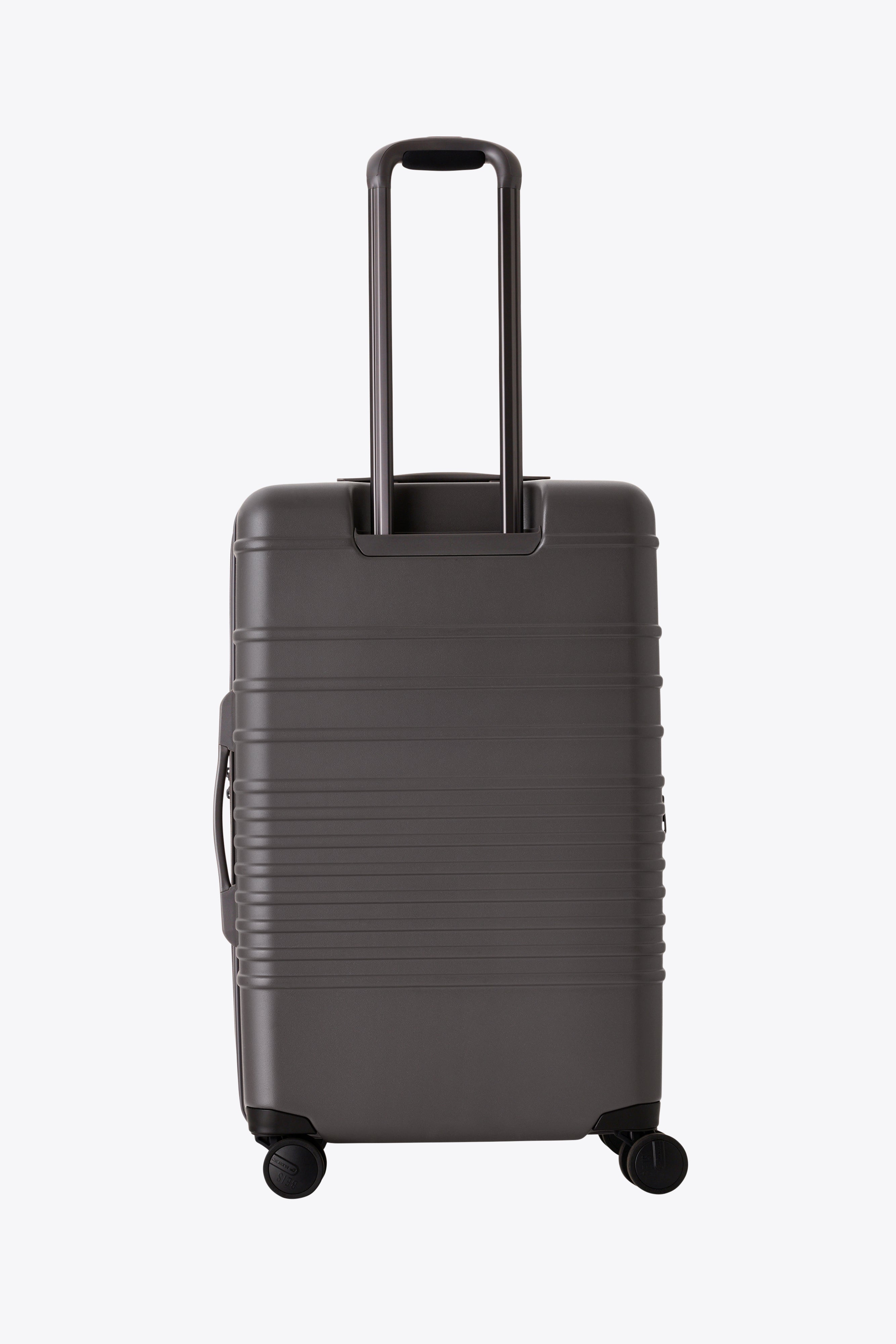 The Medium Check-In Roller in Charcoal